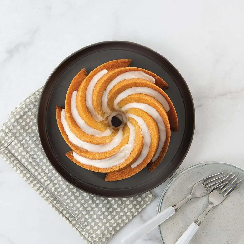 Golden Plated Bundt Cake Mould in Aluminum with Elegant Design and Resin Epoxy Mold Perfect for Kitchenware and Bakery Use